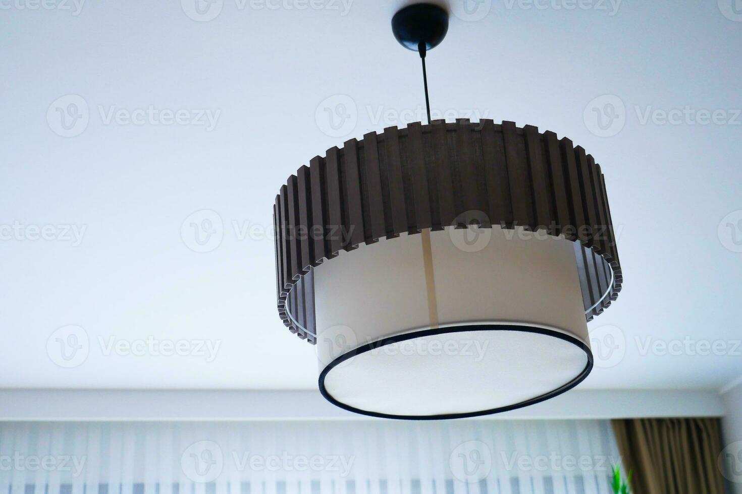 gray ceiling lamp hanging in a room , photo