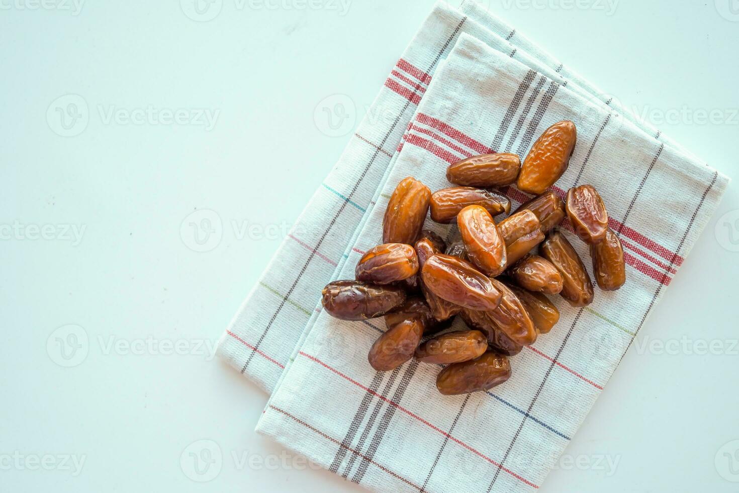top view of fresh date fruit in a bowl on table photo