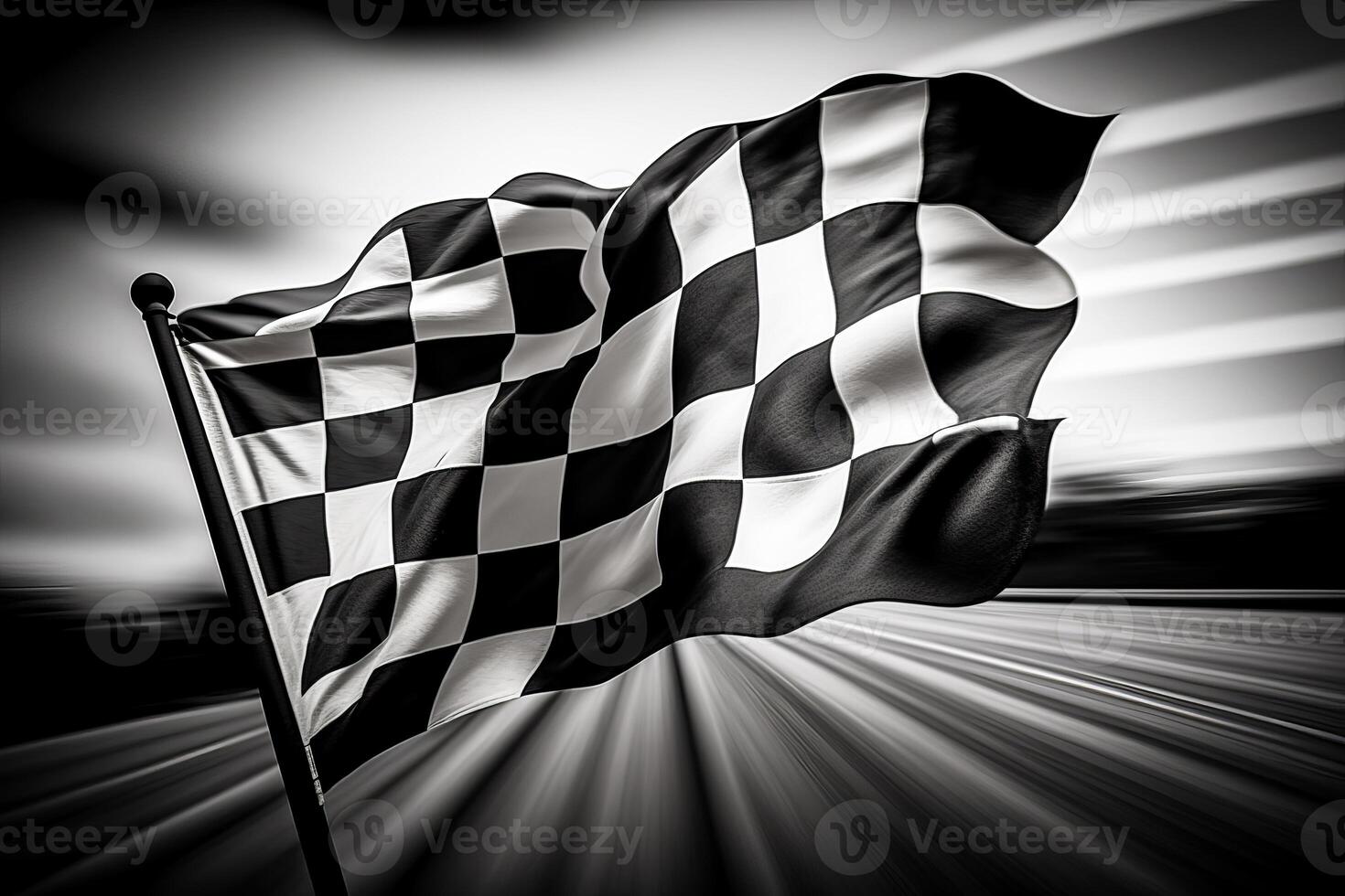 Black and white photo of checkered flag waving in the wind.