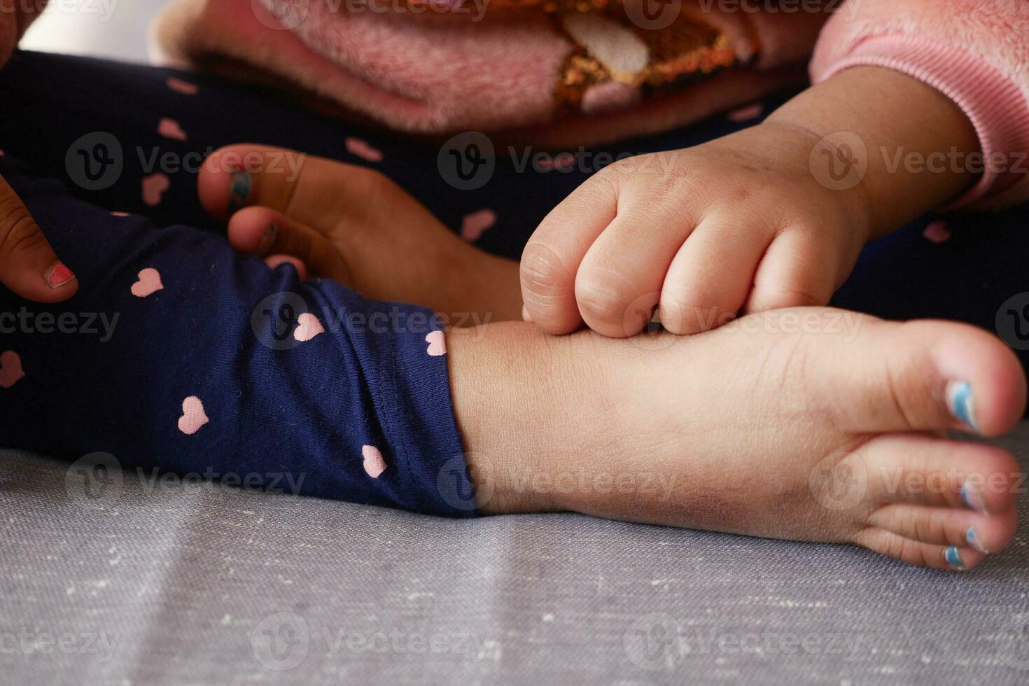 child girl suffering from itching skin, close up. photo