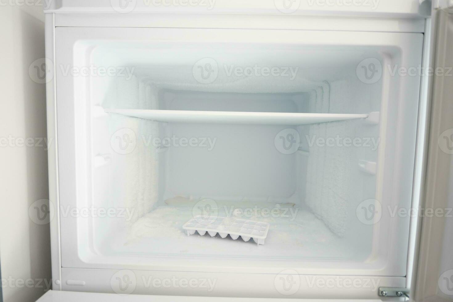 open empty fridge at home photo