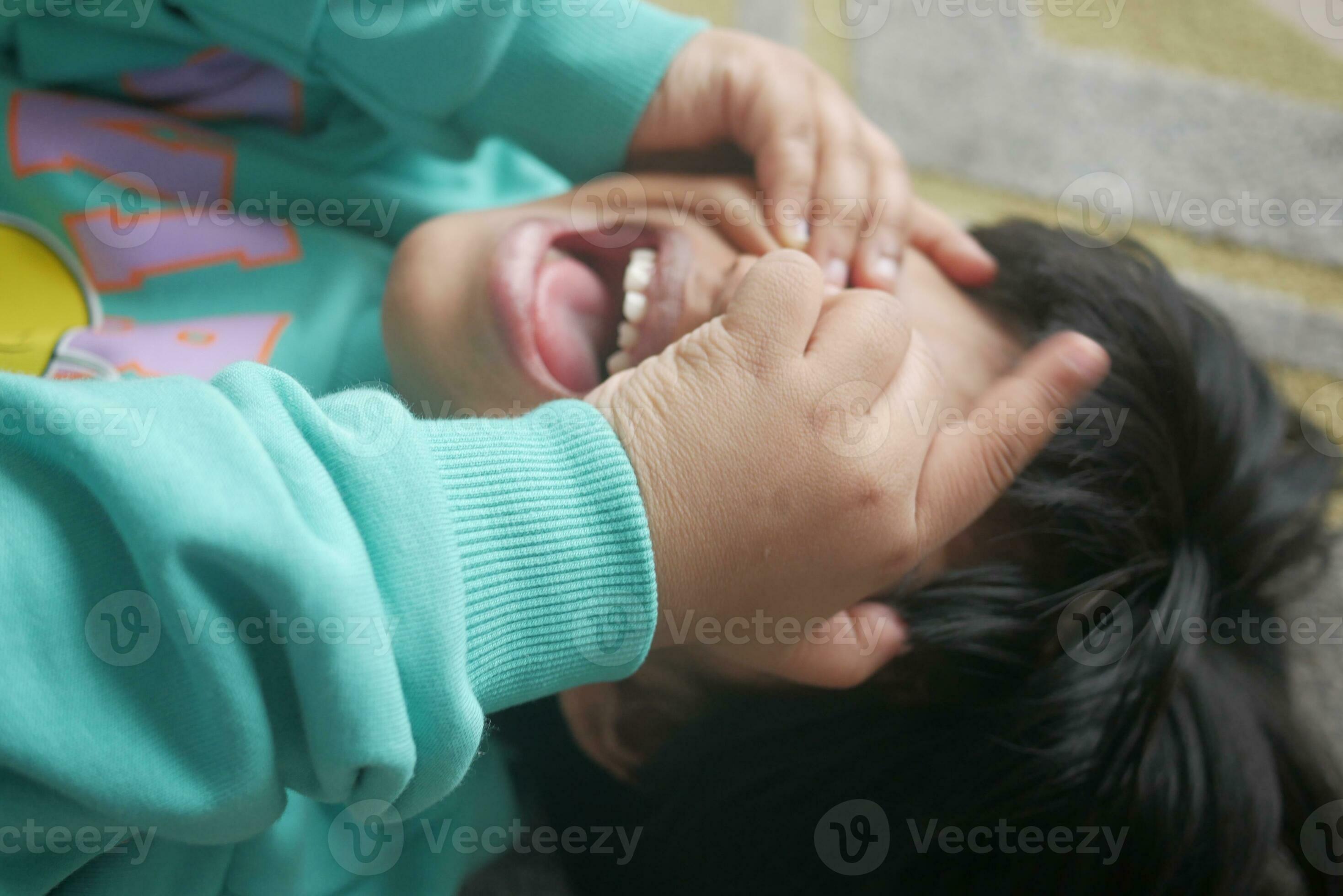 a upset child girl cover her face with hand 26459742 Stock Photo at