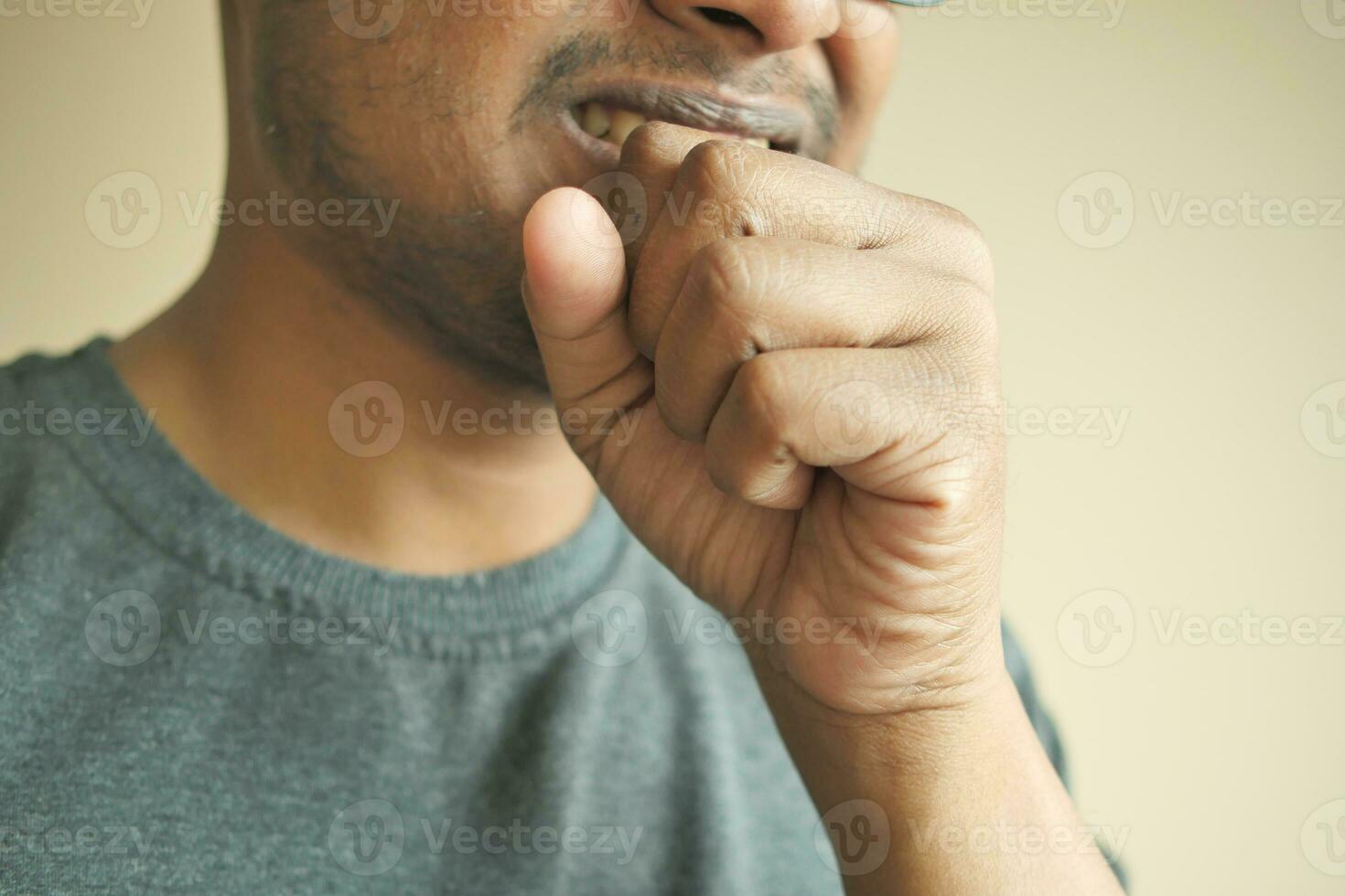 young sick man coughing and sneezes photo
