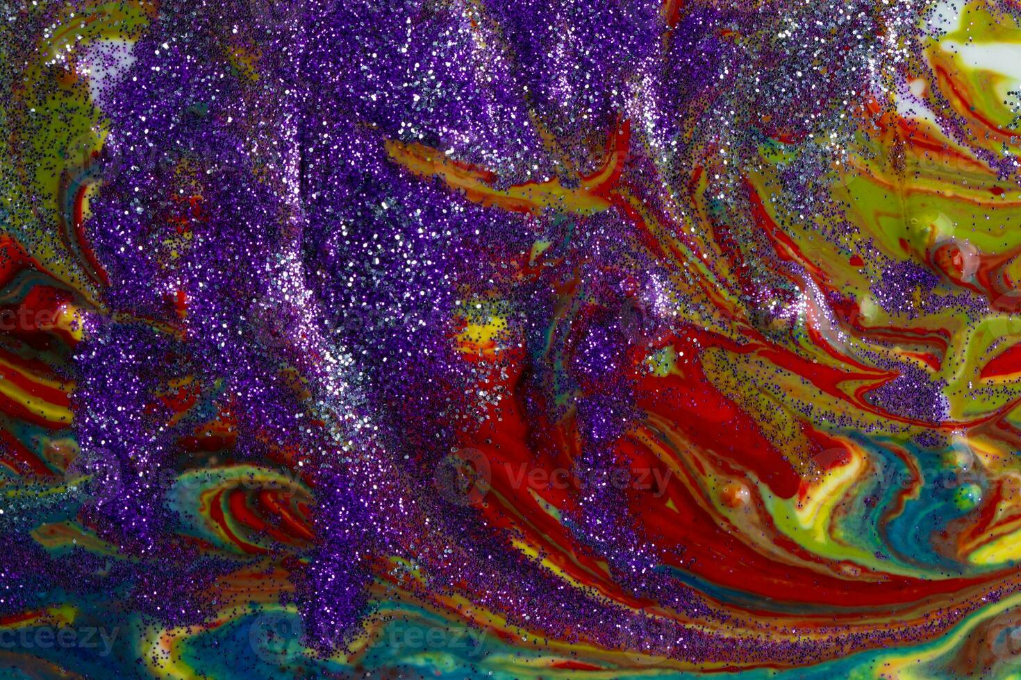 Multicolored acrylic backdrop sprinkled with purple sparkles. Contemporary creativity. Colorful avant-garde rich texture. A background made up of many shapes and materials. photo