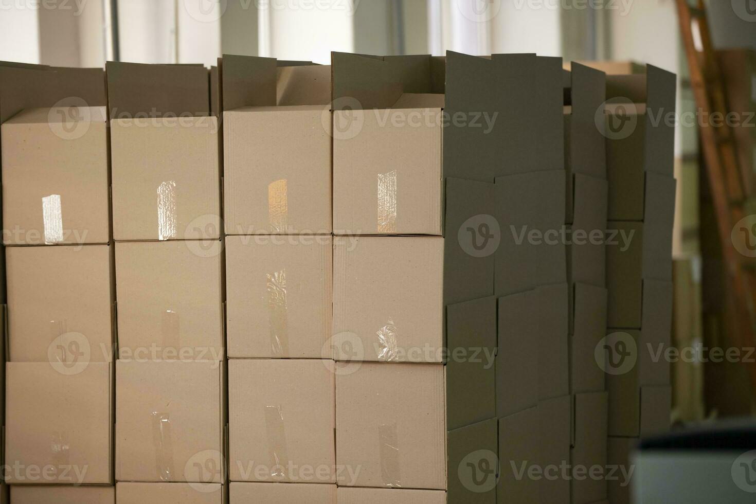 Lots of cardboard boxes stacked in rows. photo