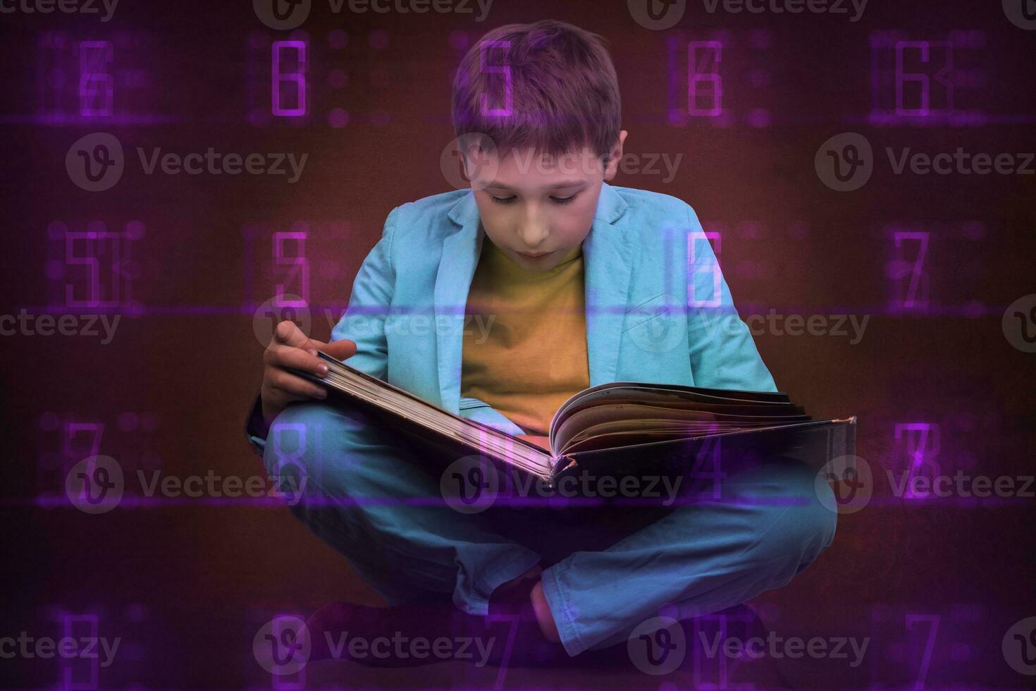 A boy in a suit sits with a book on an abstract futuristic background with numbers. The process of gaining knowledge. photo