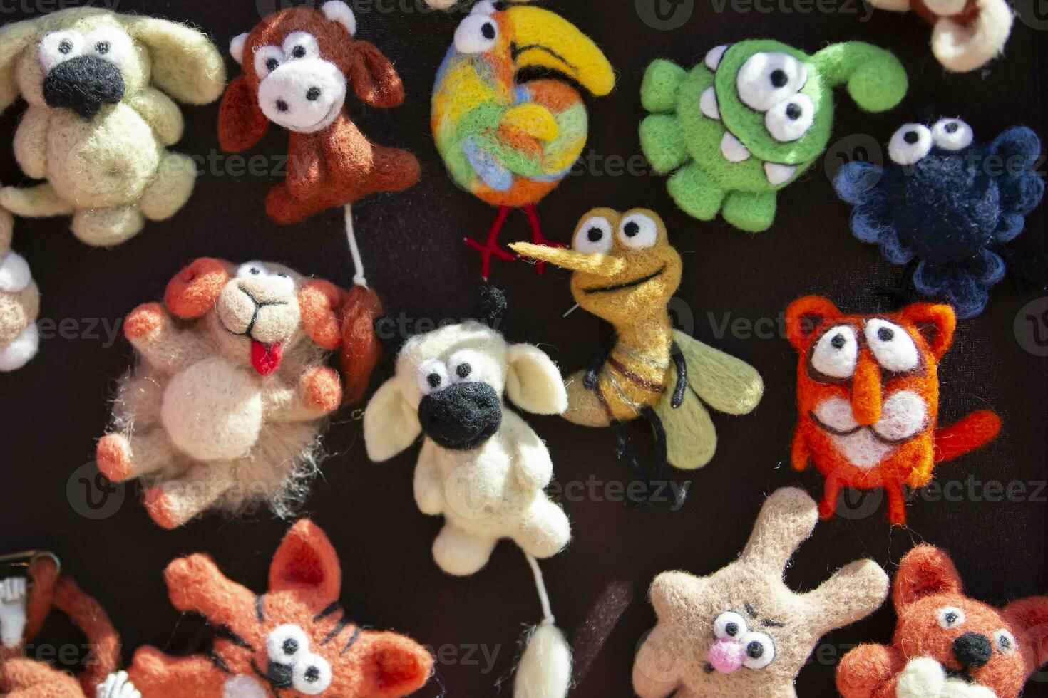 Funny multi-colored felted wool toys. photo