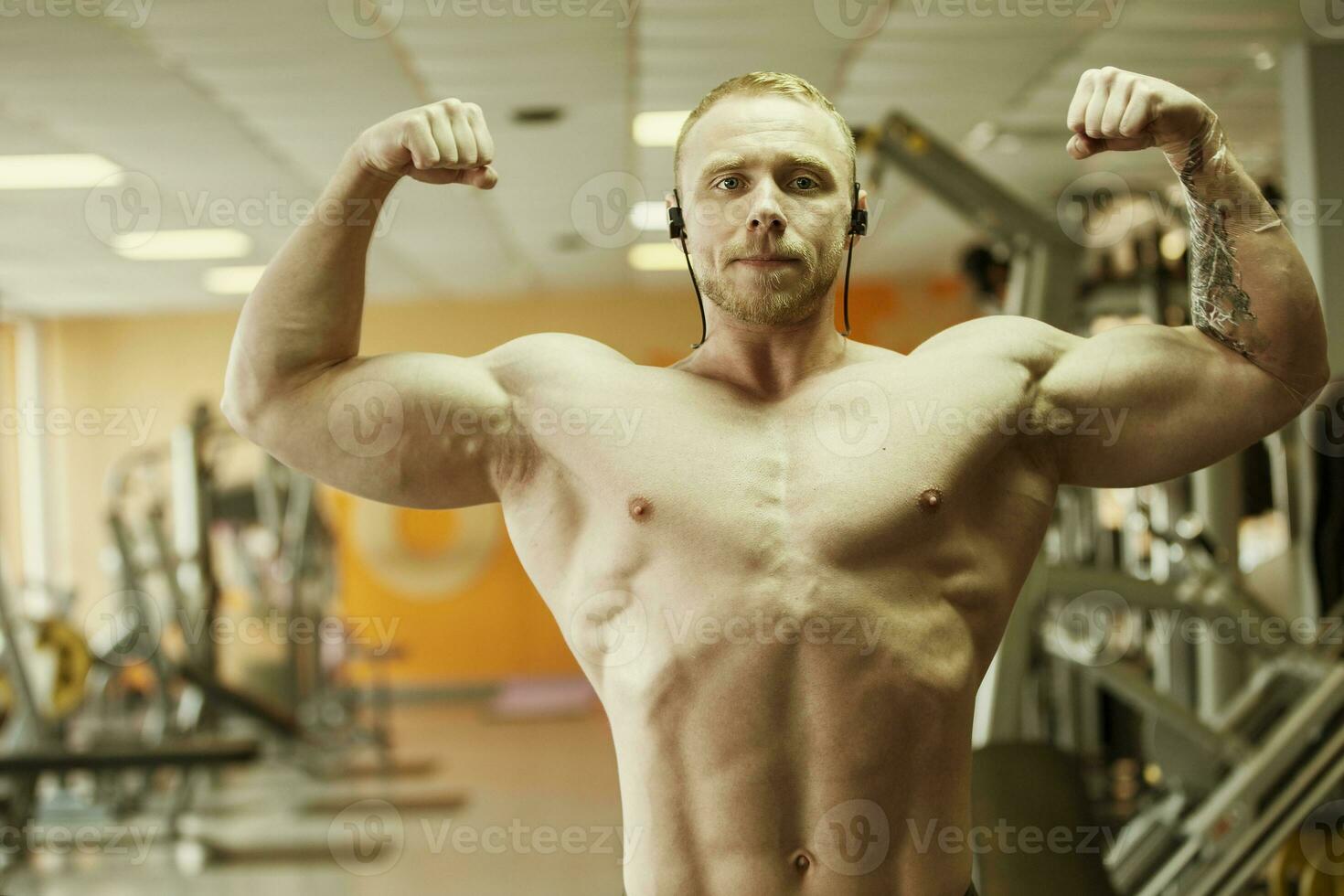 Advertising shot of a extreme bodybuilders in the gym. Concept