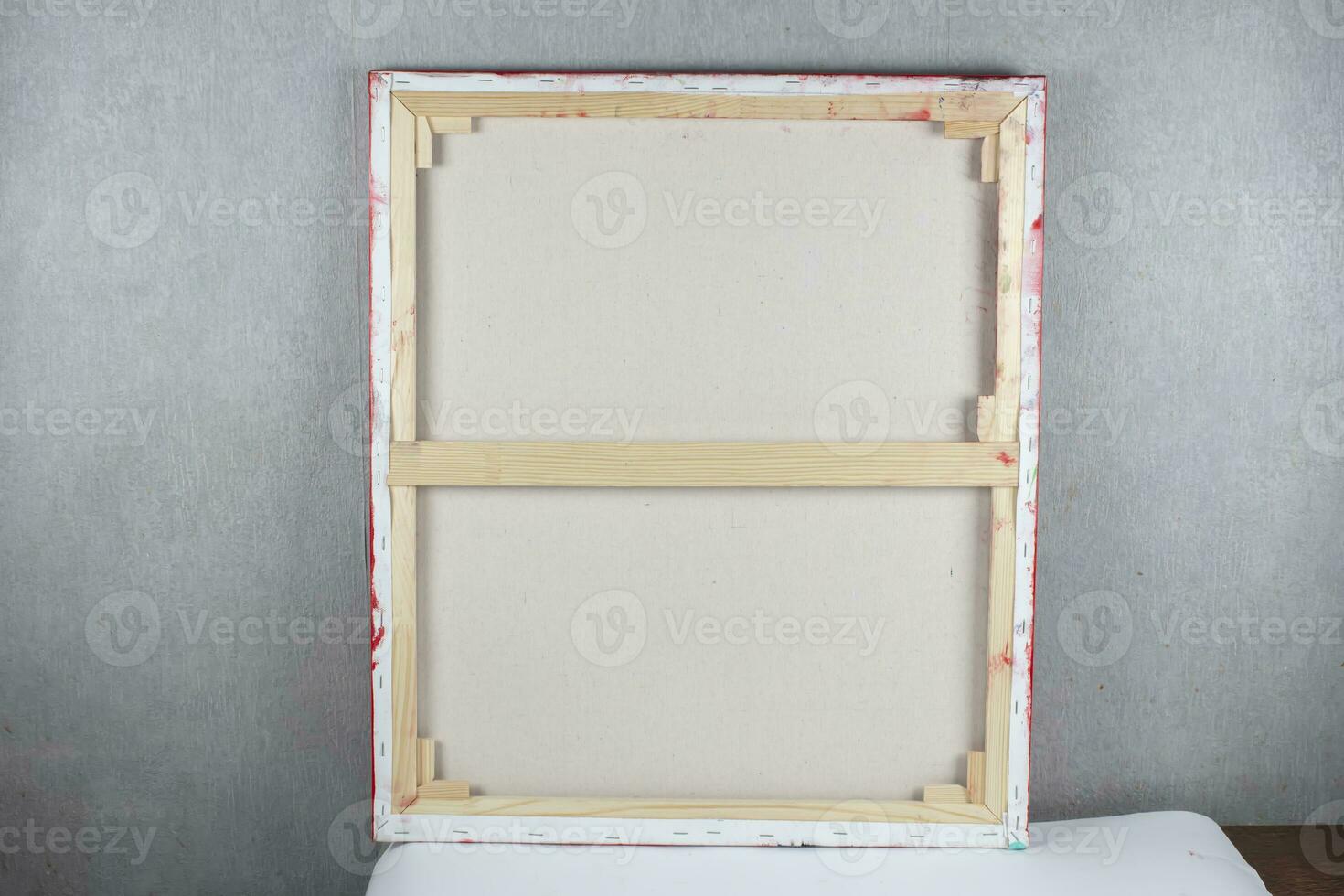 Wooden frame from the picture on the back against the background of the gray wall. photo