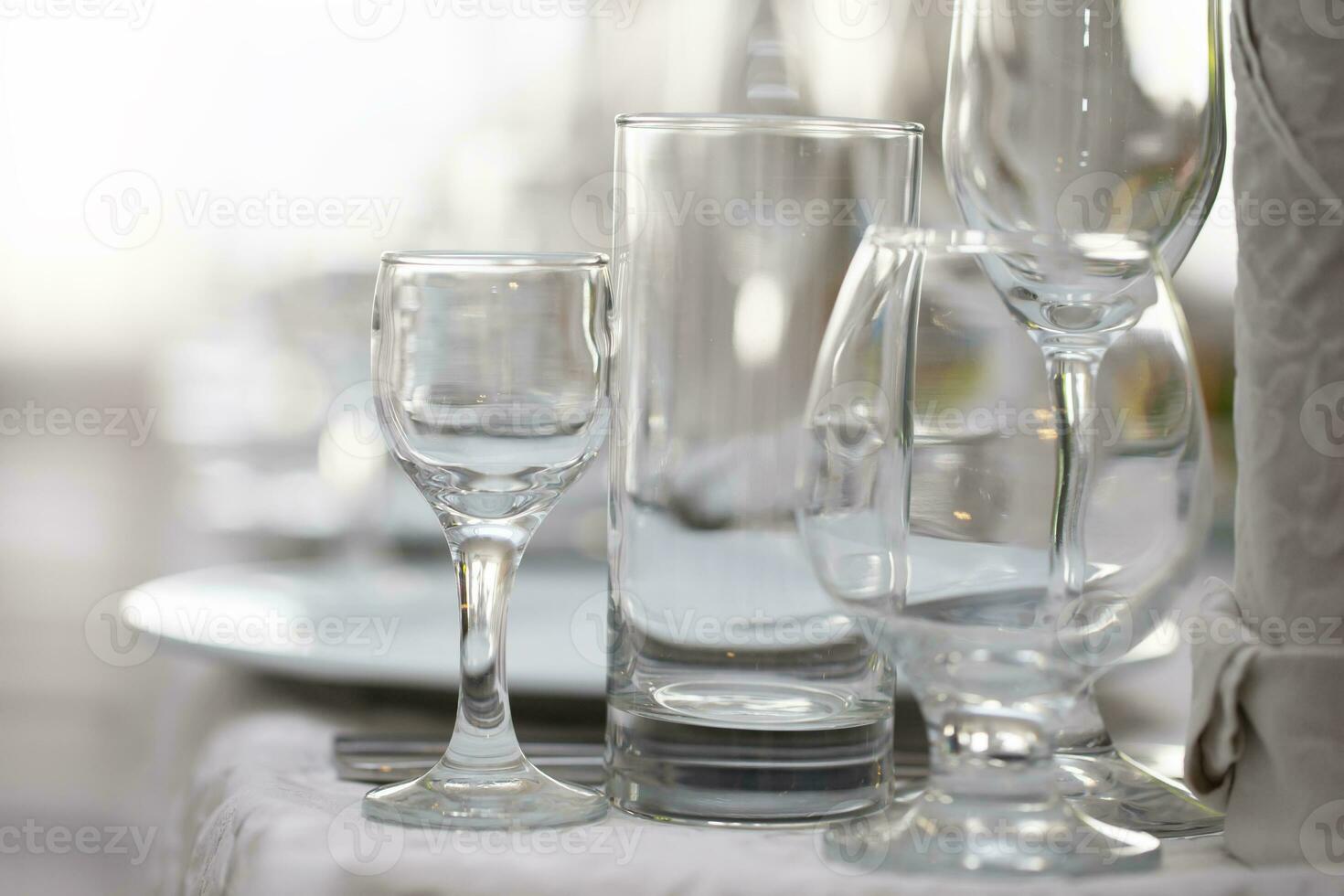 Various glass glasses on the restaurant table. photo