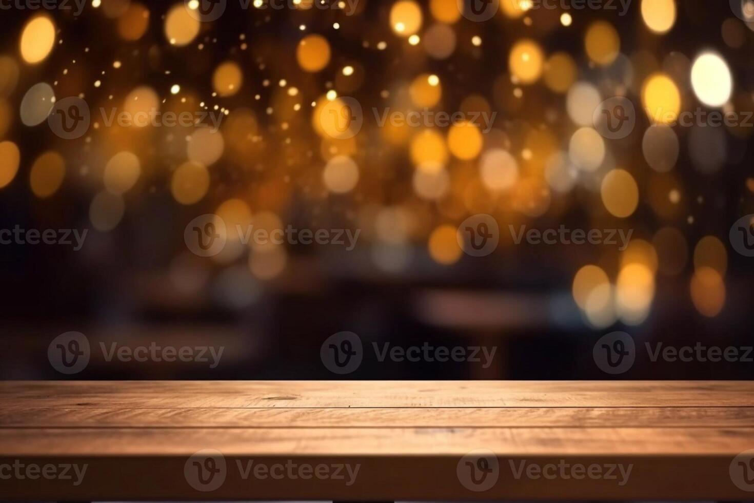 rustic wooden table in front of glitter black and gold bokeh lights photo