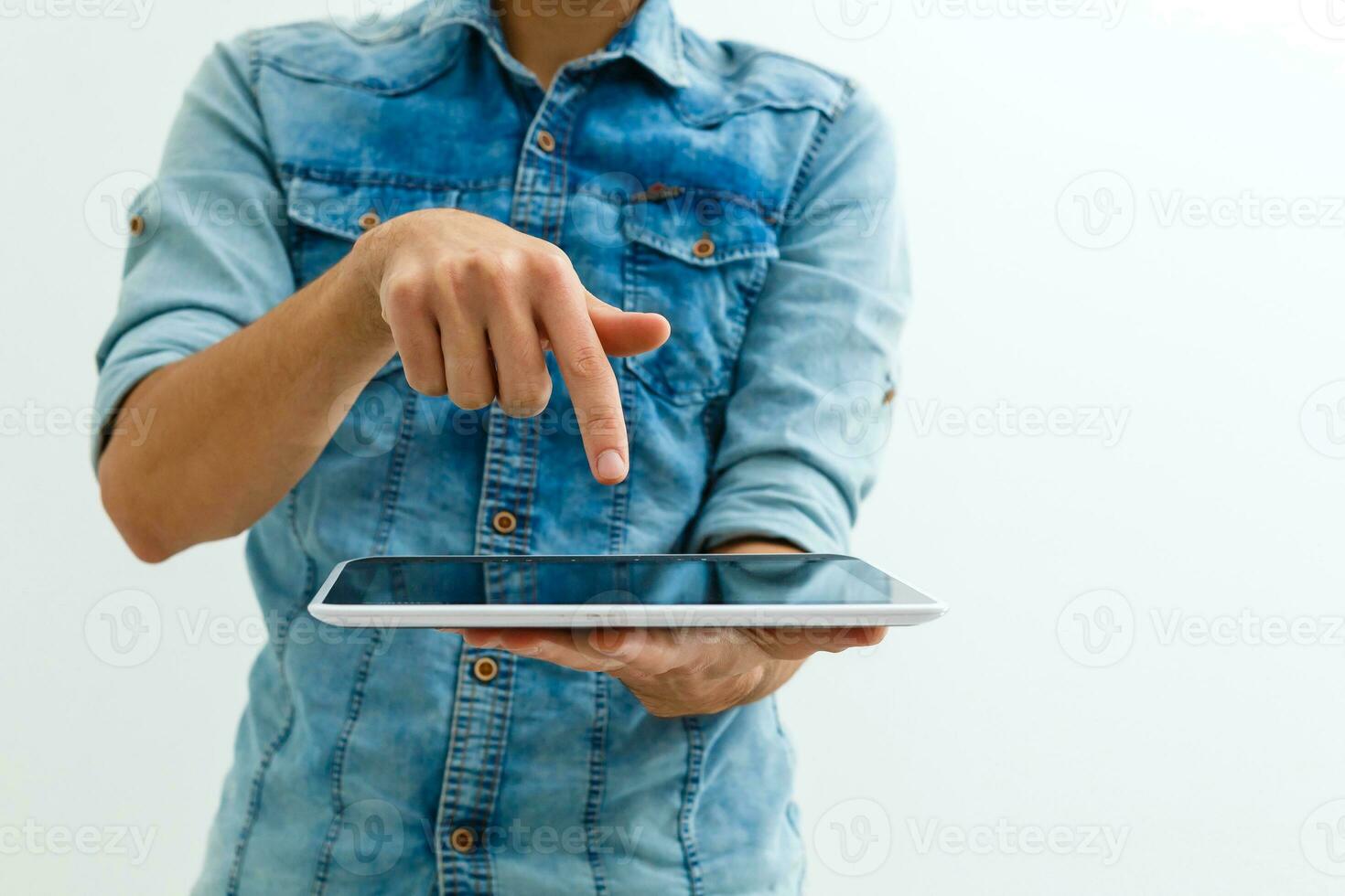 Close up of a man using mobile tablet photo