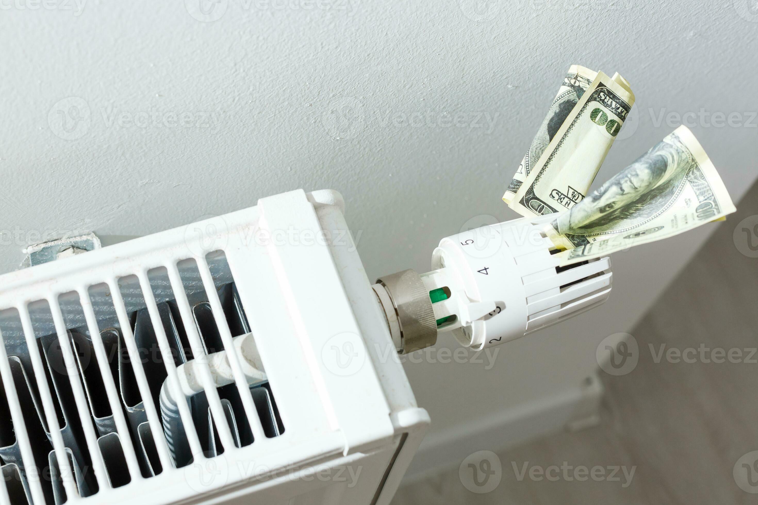 heating thermostat with money, dollar, expensive heating costs concept 26461460 Stock Photo at