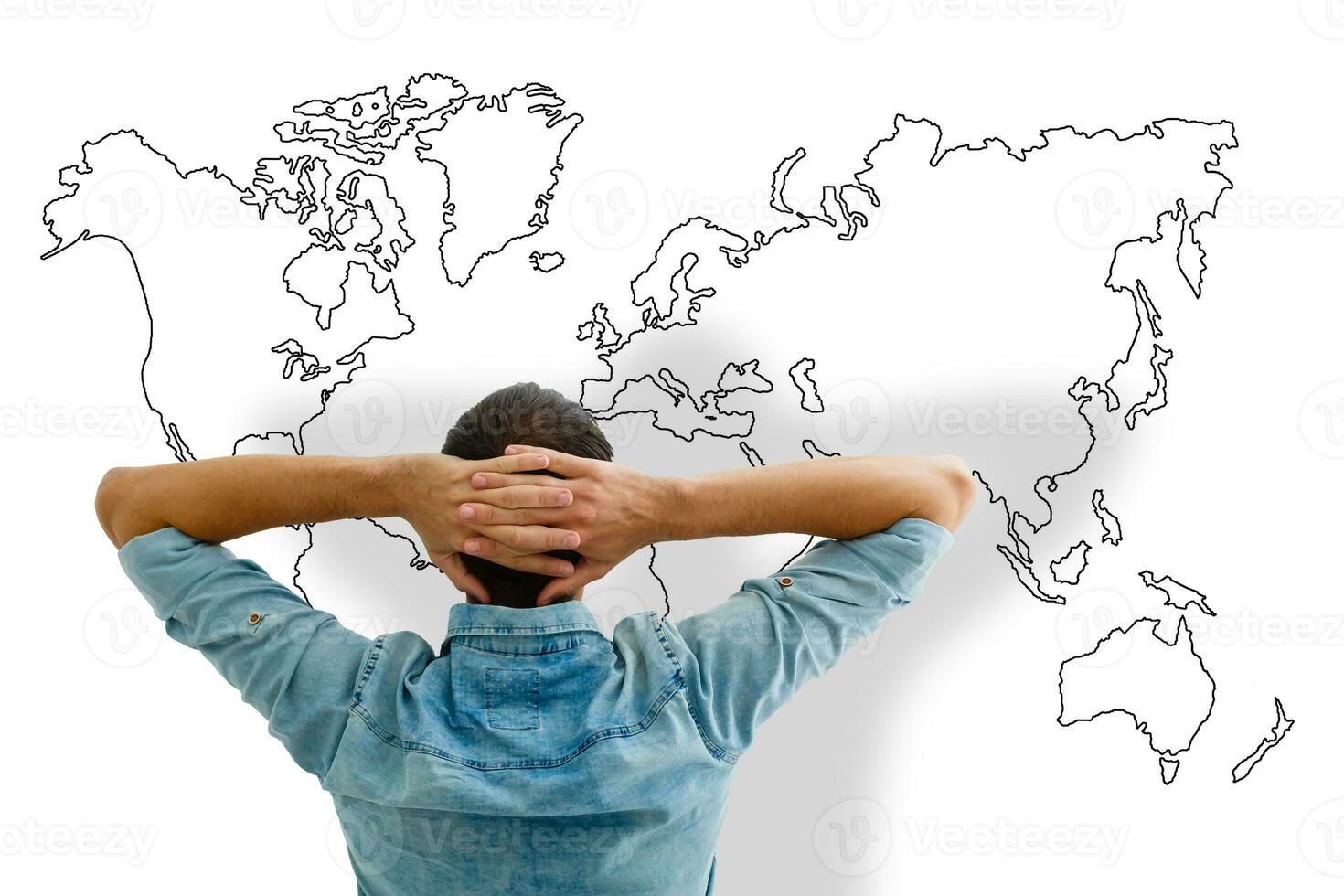 Businessman leaning back looking at world map photo