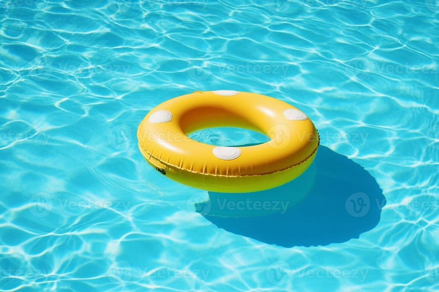 Colorful inflatable tube floating in swimming pool, summer vacation concept photo