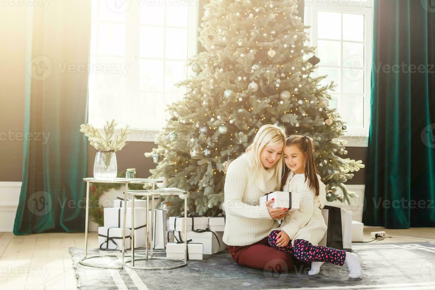 holidays, presents, christmas, x-mas, birthday concept - happy mother and child girl with gift box photo