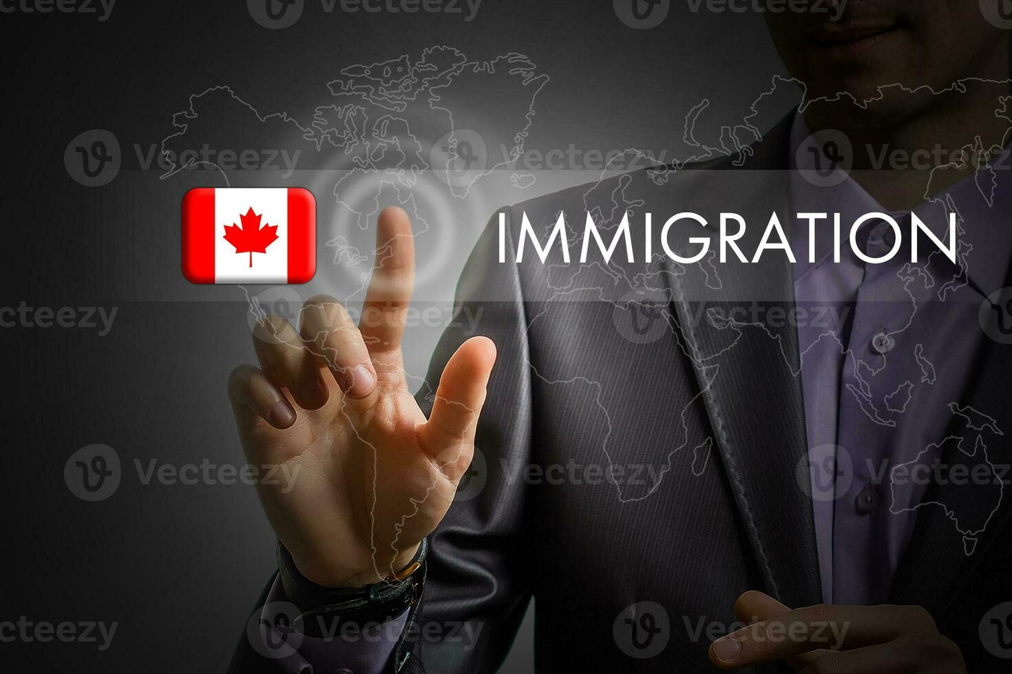 Canada immigration concept. Man pressing virtual button with flag icon photo