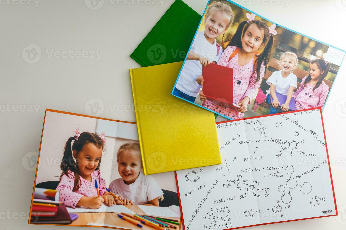 photos of children and book with formula of science, chemistry, and physics