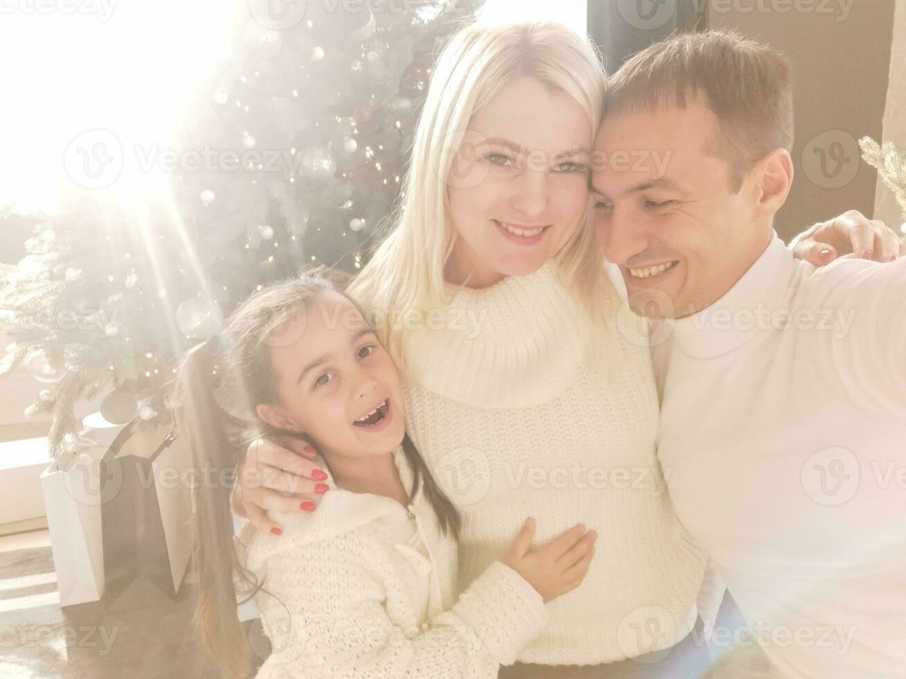 Portrait of friendly family on Christmas evening photo