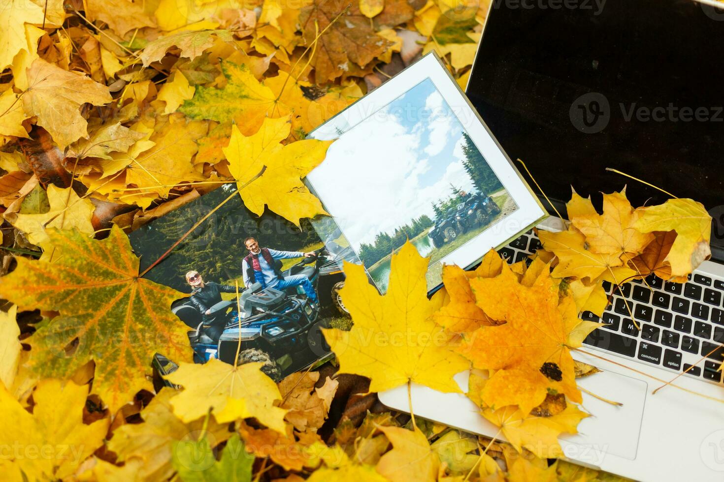 photo book on the yellow leaves top view. rustick photo of autumn composition