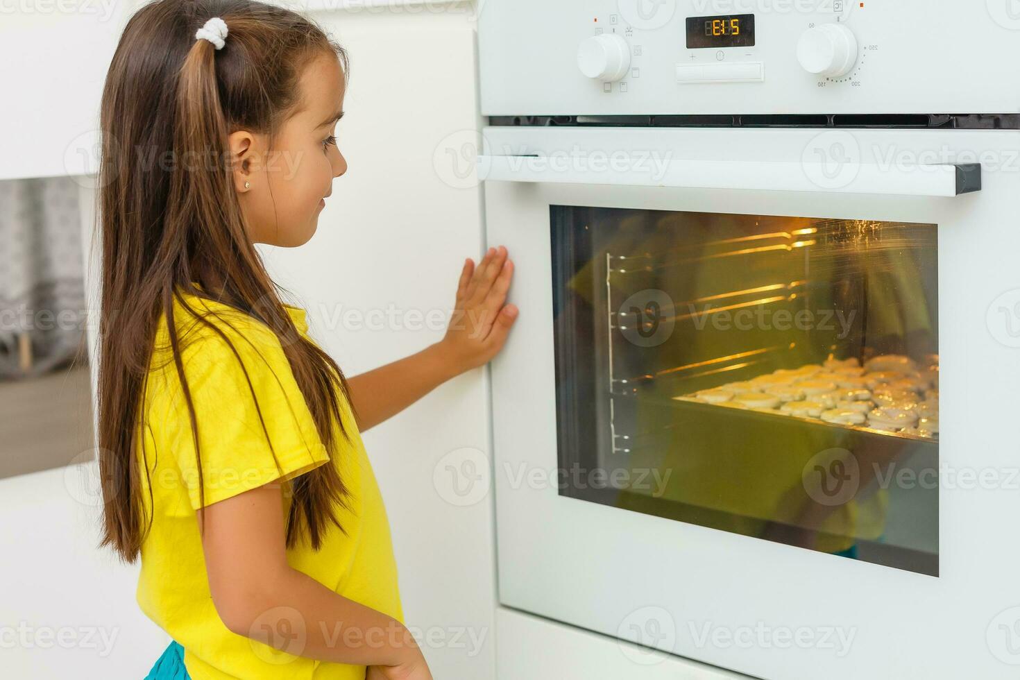 Little girl make cookies at the advent time. photo