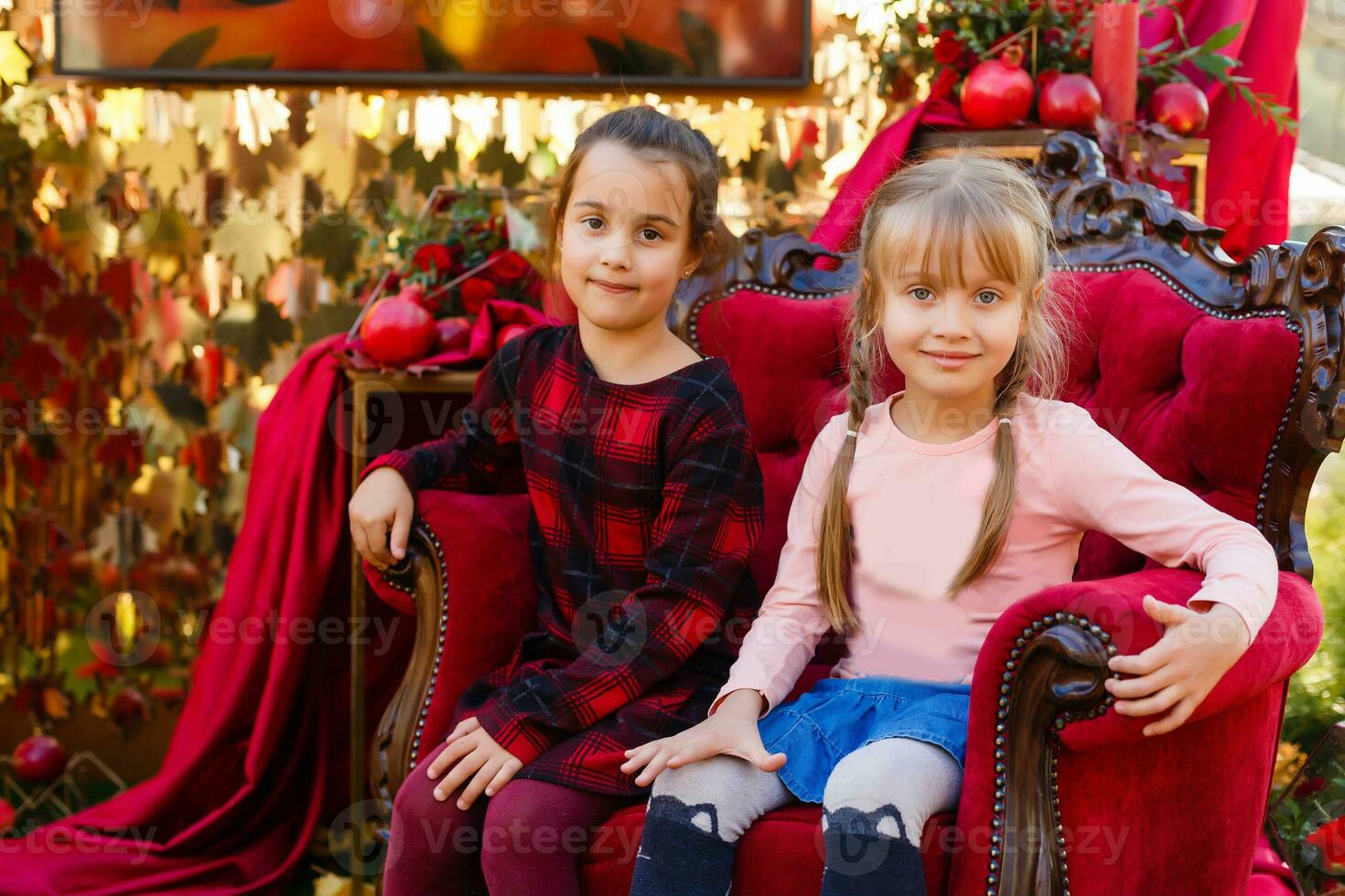 Cute little girls at the autumn fair photo