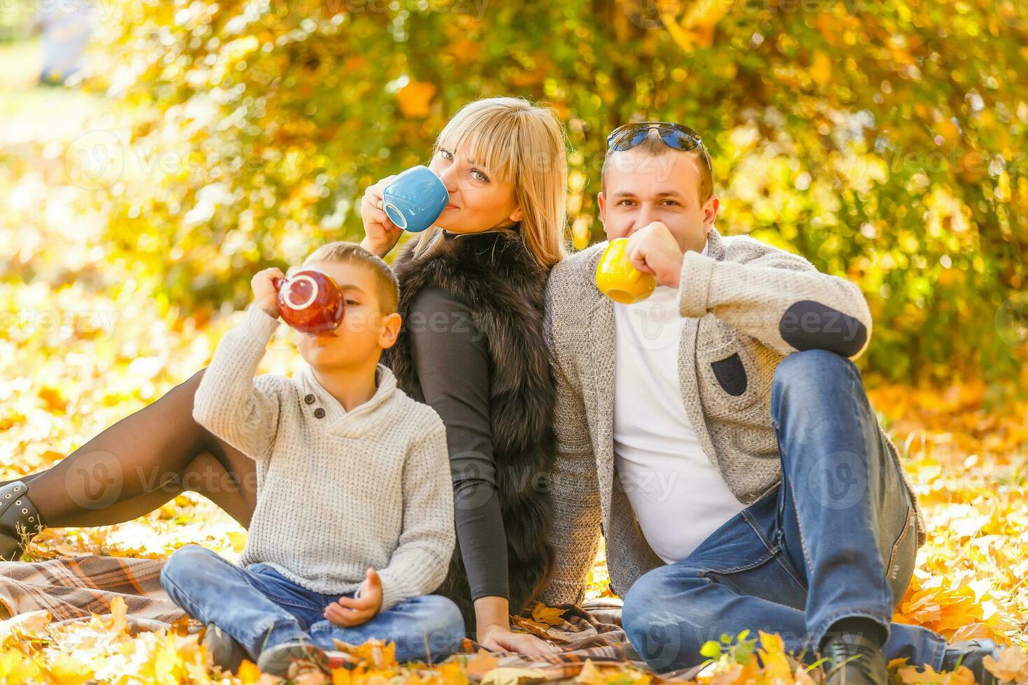 Happy Family in Autumn Park. Picnic photo