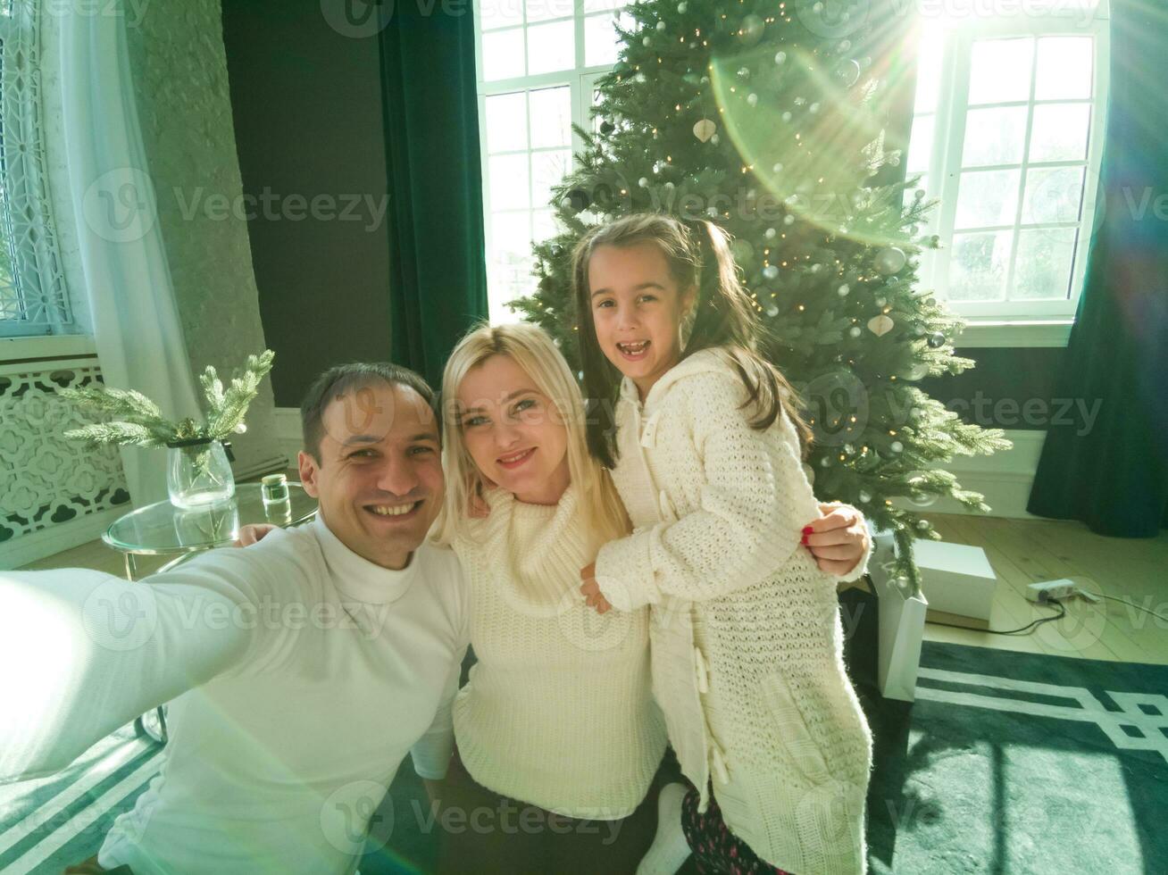 family, christmas, x-mas, winter, happiness and people concept - smiling family with many gift boxes photo