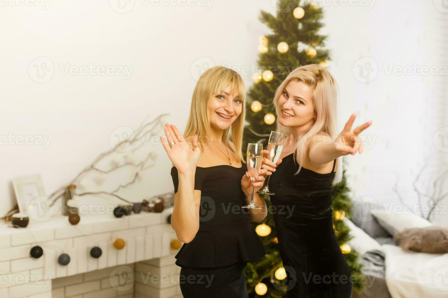Two girlfriends exchanging christmas presents photo