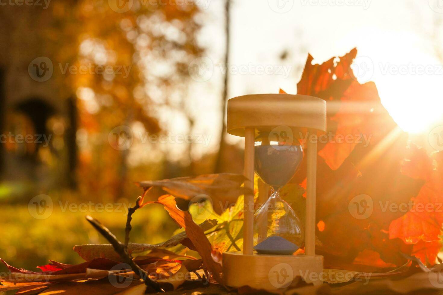 Clock, Hourglasses and Autumn Leaves photo