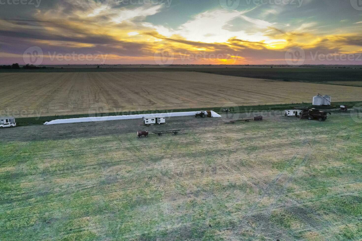 Silo bag work in pampas countryside, grain storage in La Pampa, Argentina photo