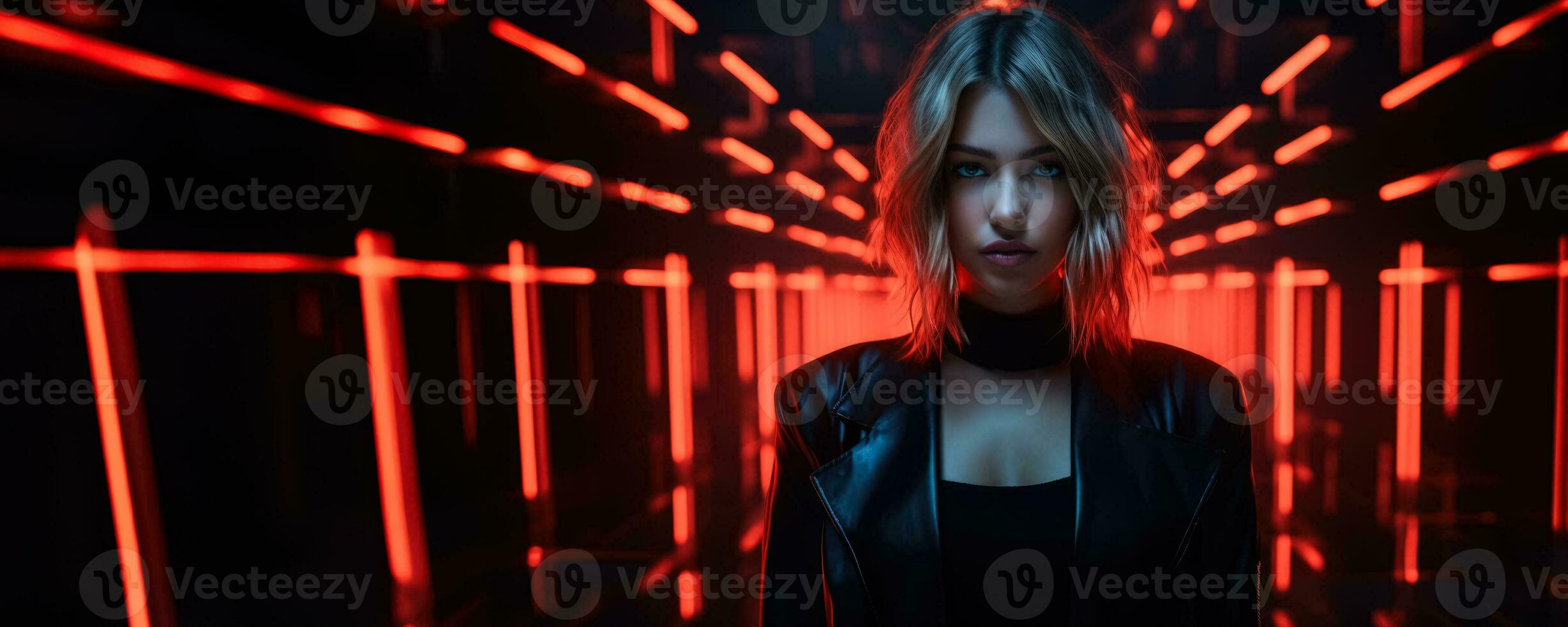 Portrait of young woman in neon on dark studio background cyber monday concept background with empty space for text photo
