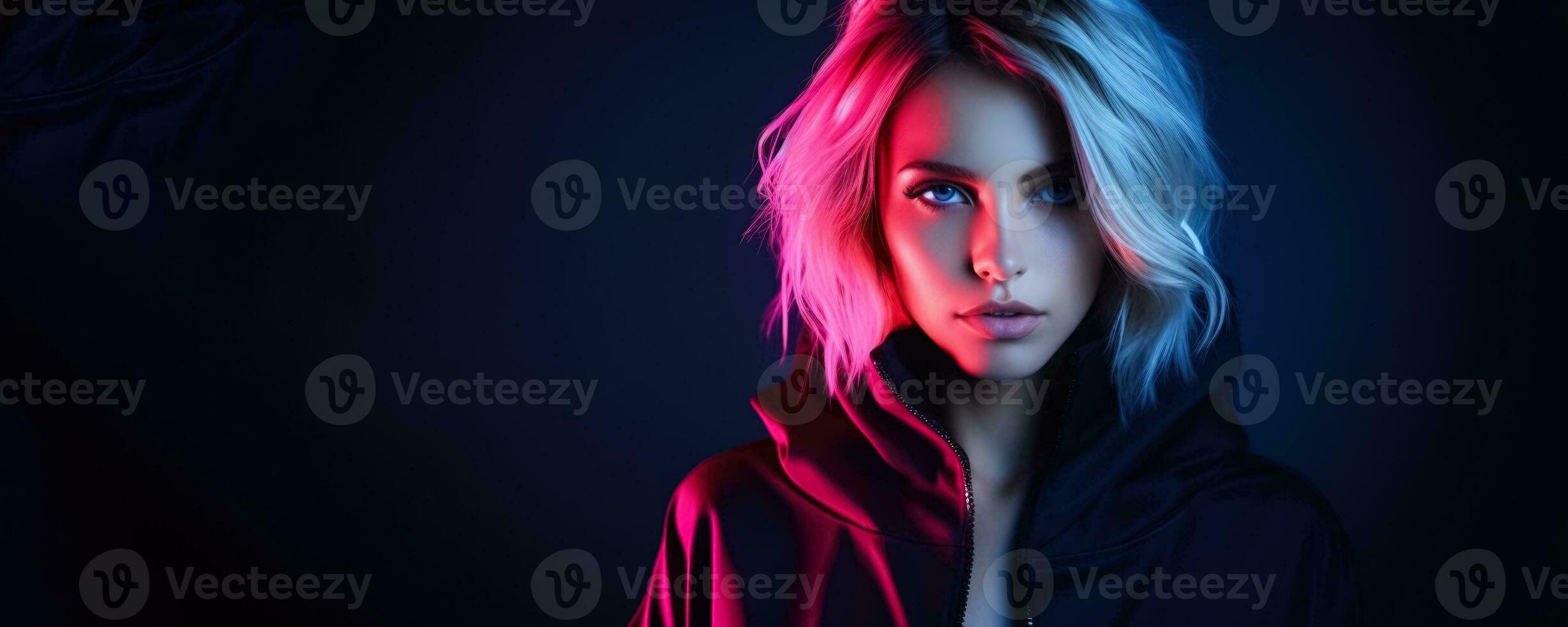 Portrait of young woman in neon on dark studio background cyber monday concept background with empty space for text photo