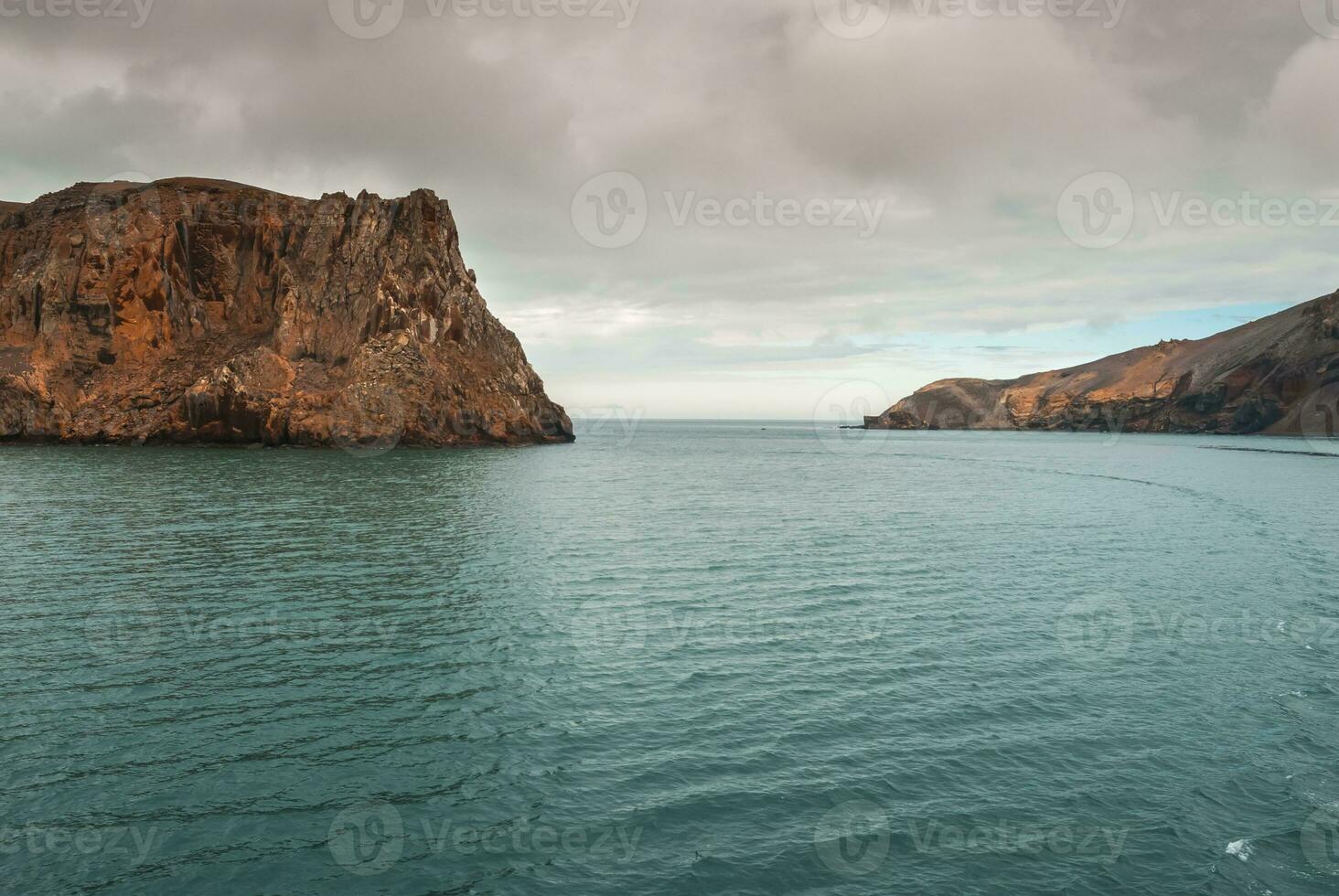 Rugged seascape, Deception Island, Antarctica photo