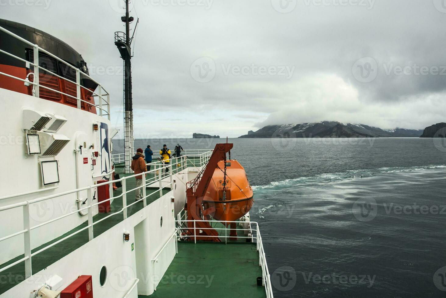 Ship in Deception Island landscape, Antarctica photo