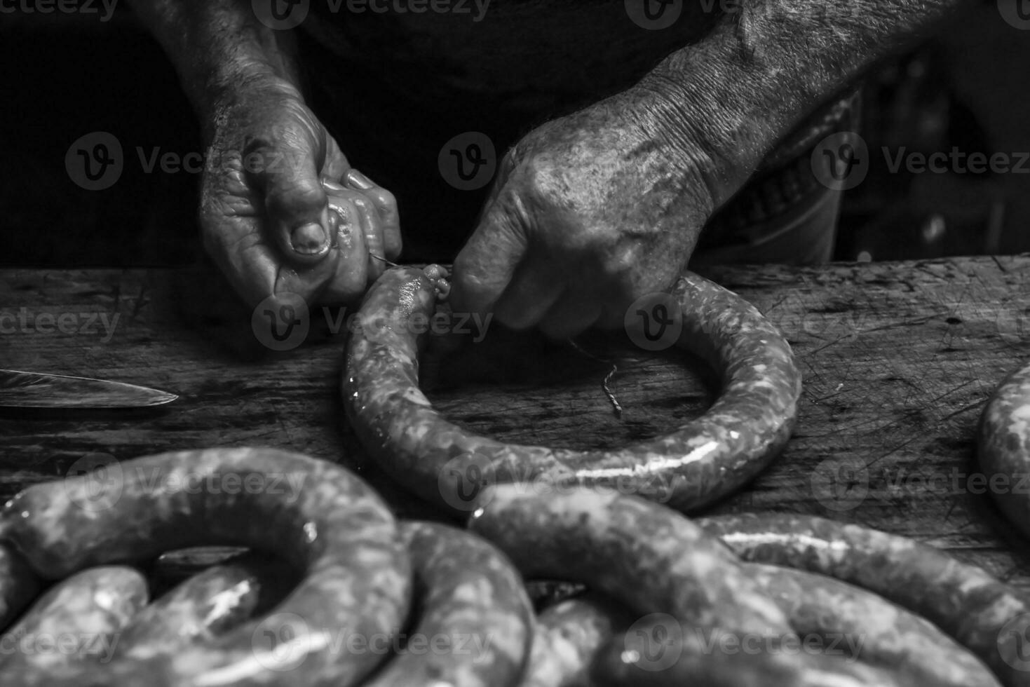 Handmade sausages traditional preparation, Patagonia, Argentina photo