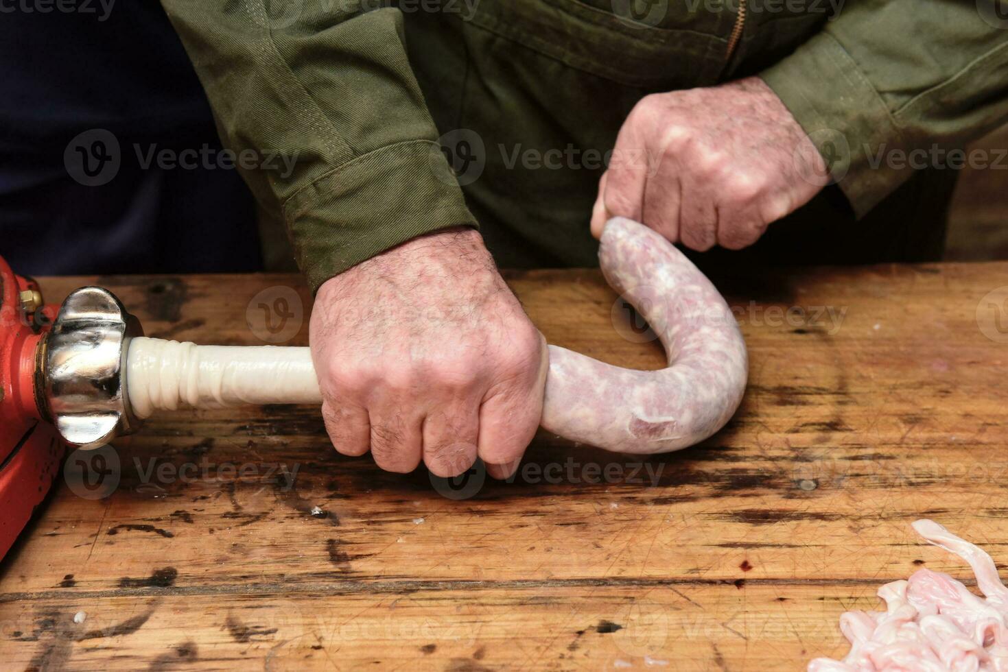 Hands making homemade sausages, Patagonia, Argentina photo