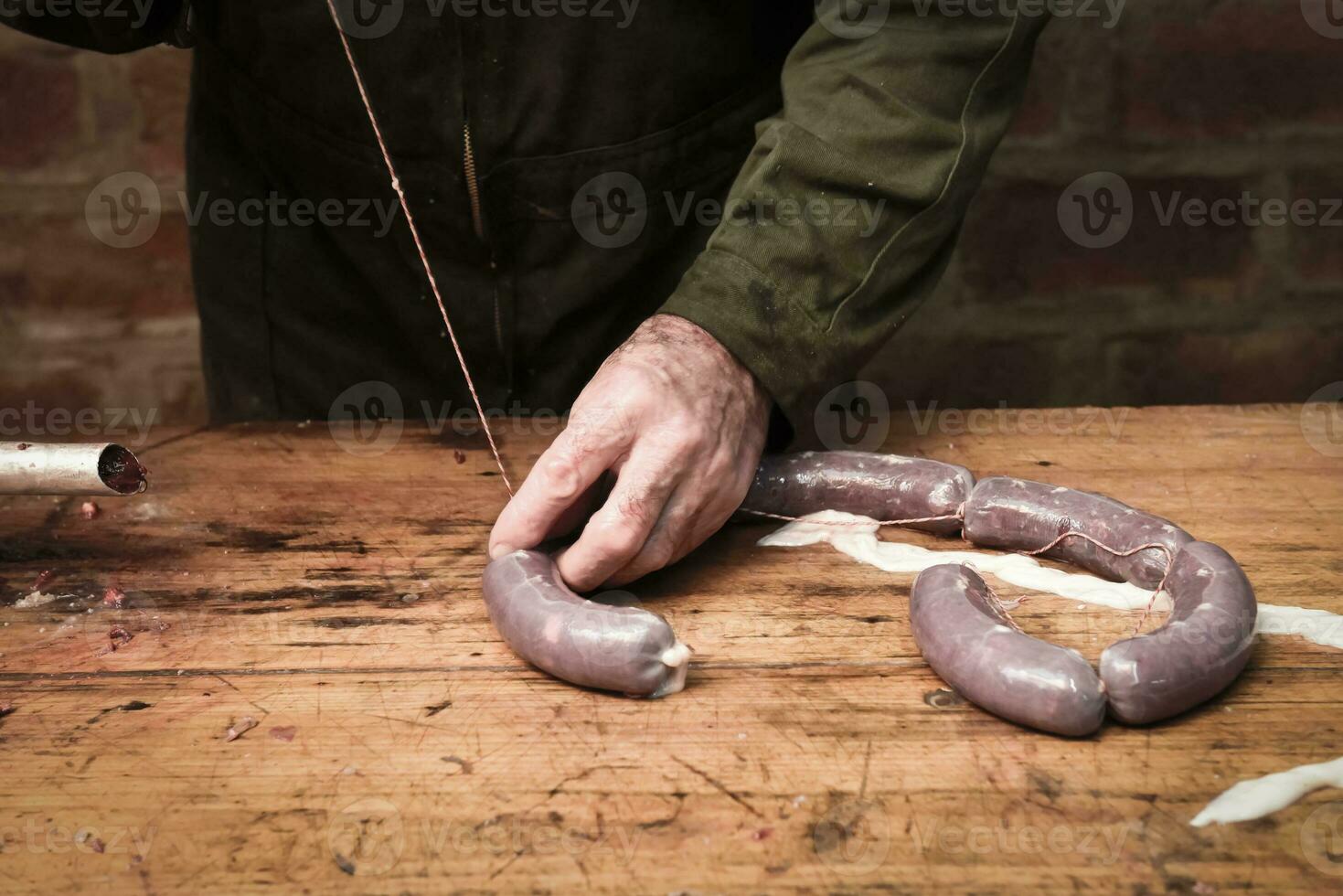 Hands making homemade sausages, Patagonia, Argentina photo