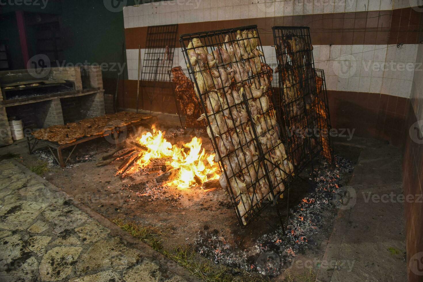 Barbecue, sausage and cow ribs, traditional argentine cuisine, Patagonia, Argentina. photo