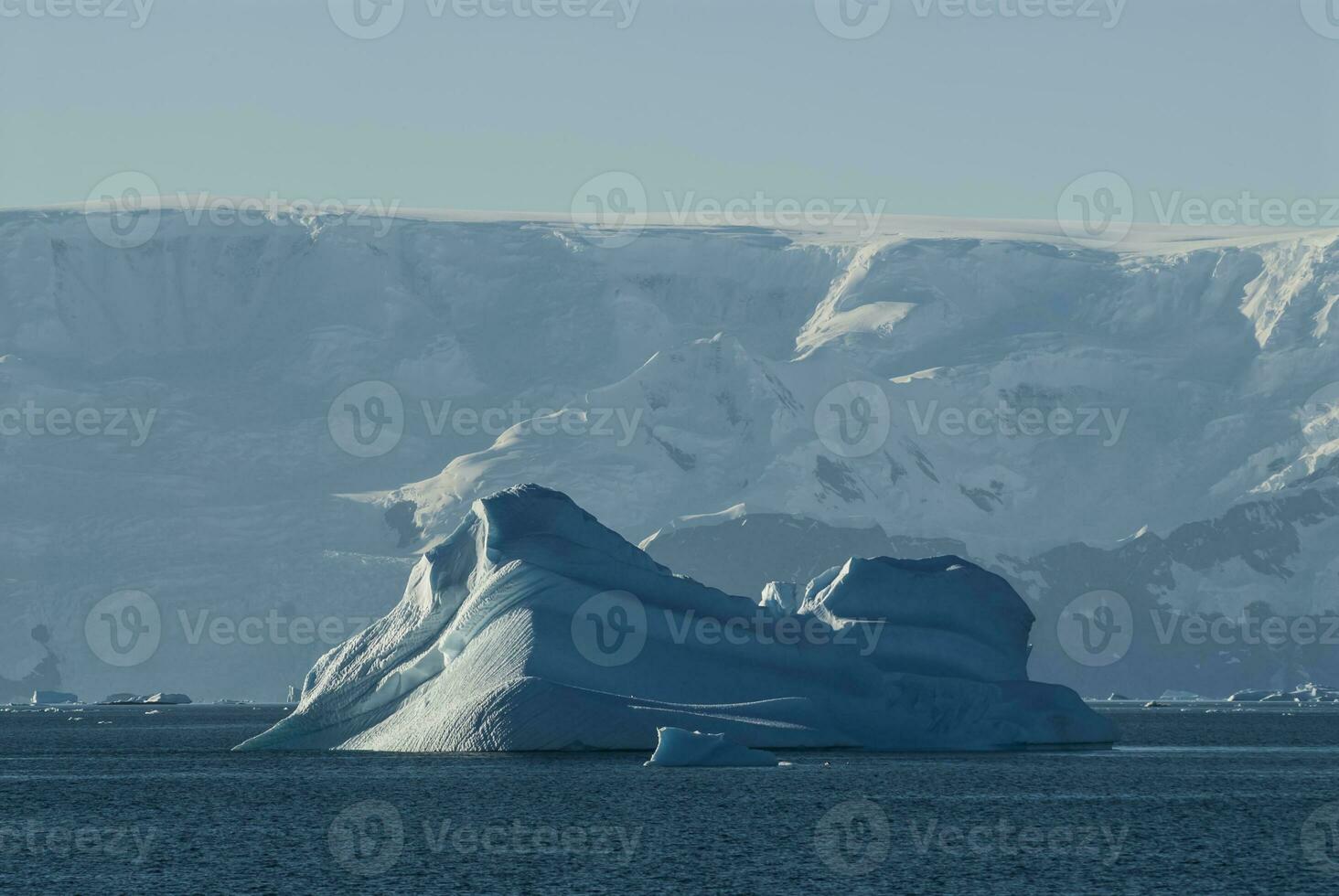 Tempano floating in the Antarctic Sea, near the Antarctic Peninsula. photo