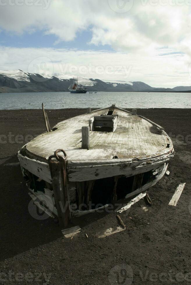 Old whaling boats on the beach of Deception Isla,Antartica photo