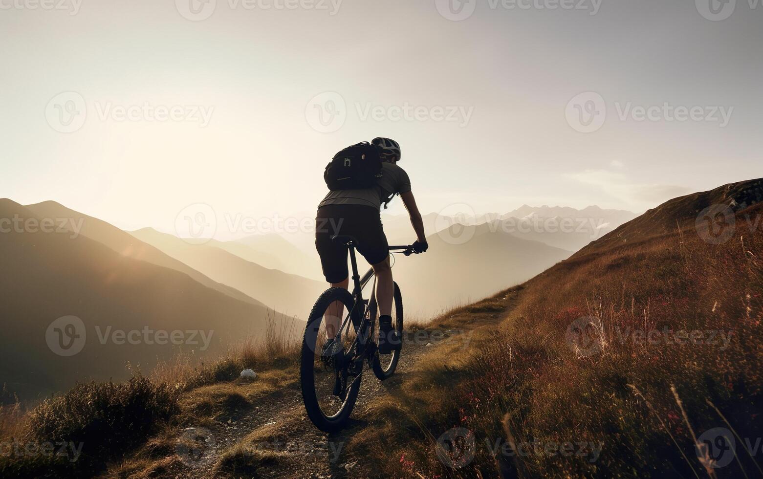 Mountain biking cyclist on a mountain trail at dawn. AI, photo