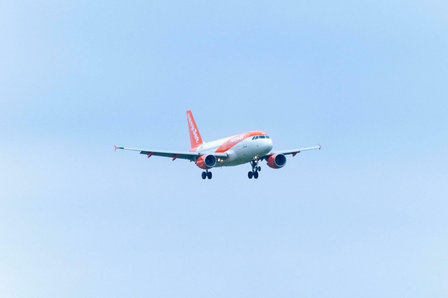 Airplane from EasyJet landing at Schiphol AirPort. Amsterdam Netherlands April 15 2023. photo