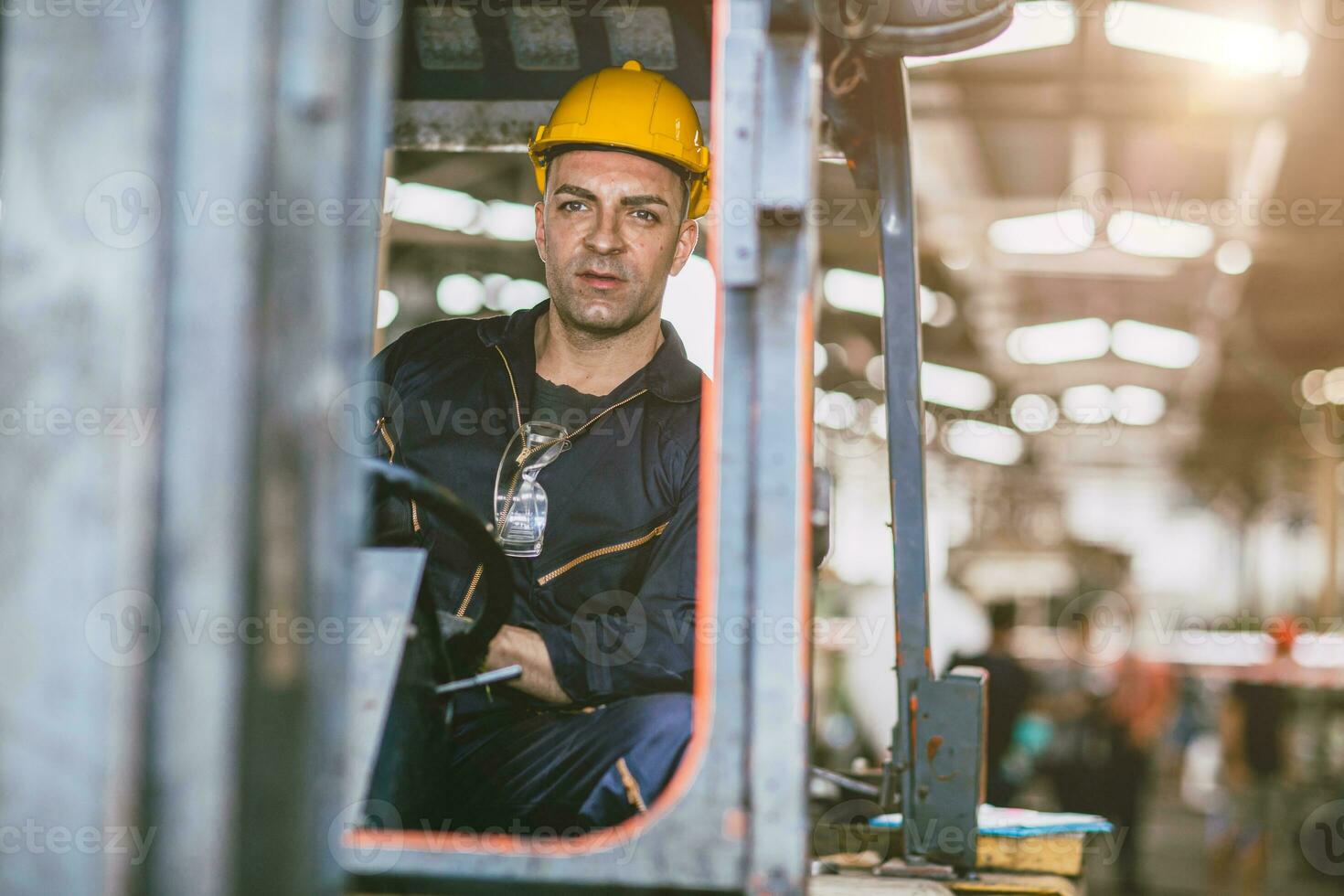 Forklift driver staff male warehouse worker working in logistics factory cargo inventory storage center. photo