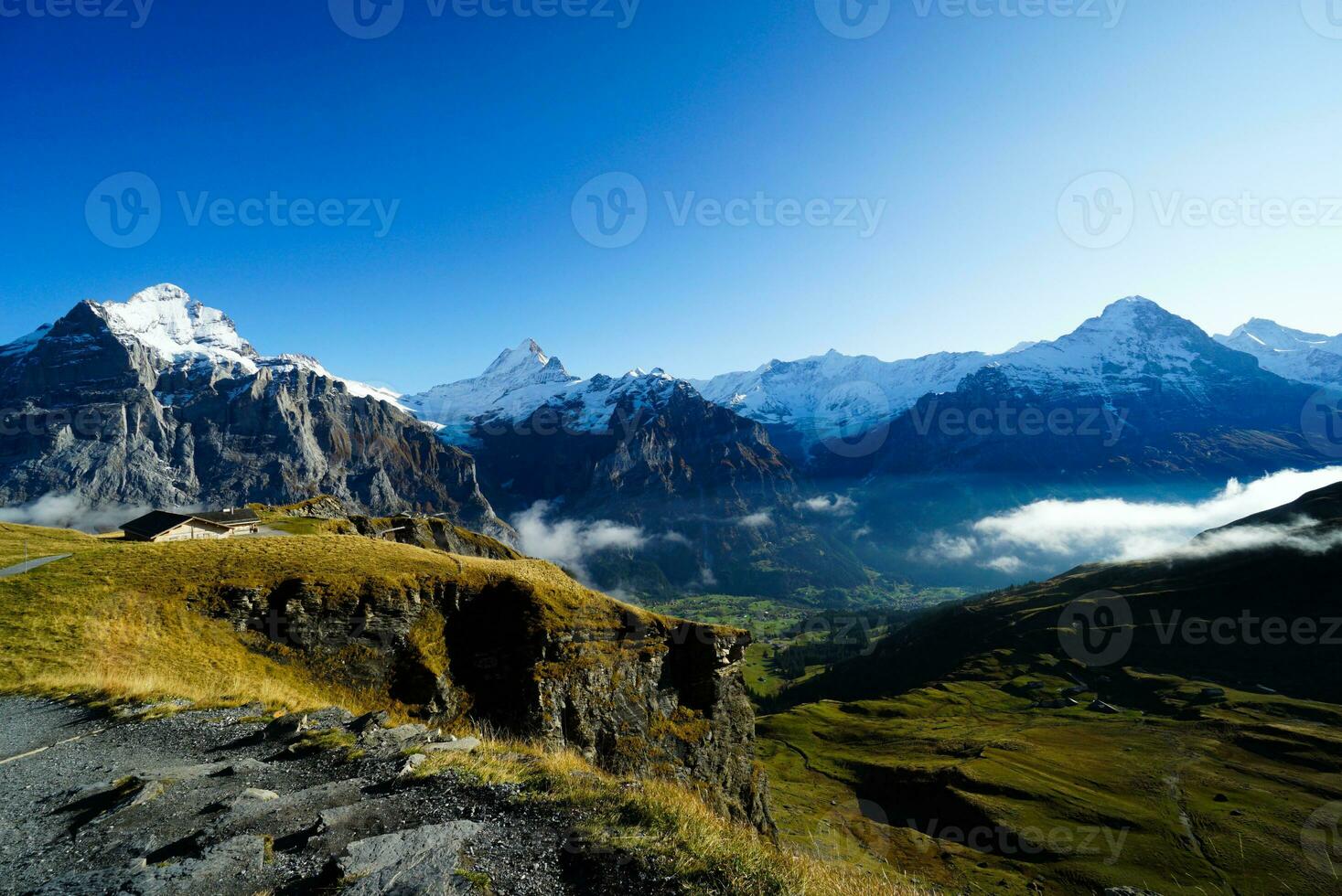 Beautiful view of nature trail in the morning, Grindelwald First, Highest peaks Eiger, Switzerland Alps. For trekking, hiking, mountaineering or nature walk activities. photo