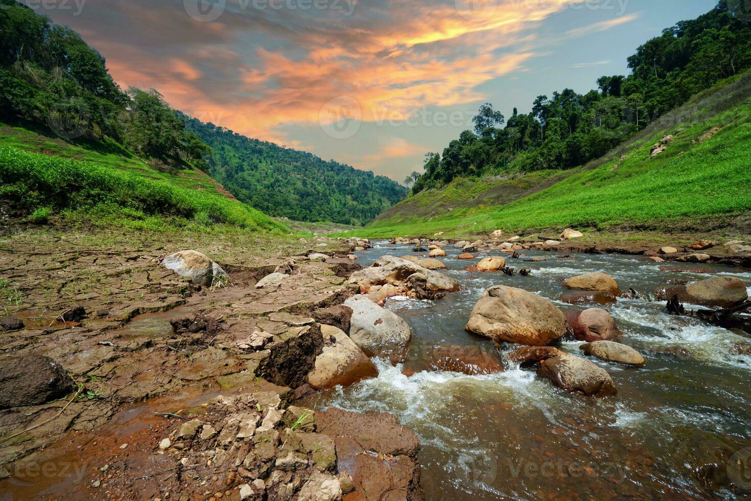 Upstream view on top of the dam Surrounded by mountains and lush nature photo