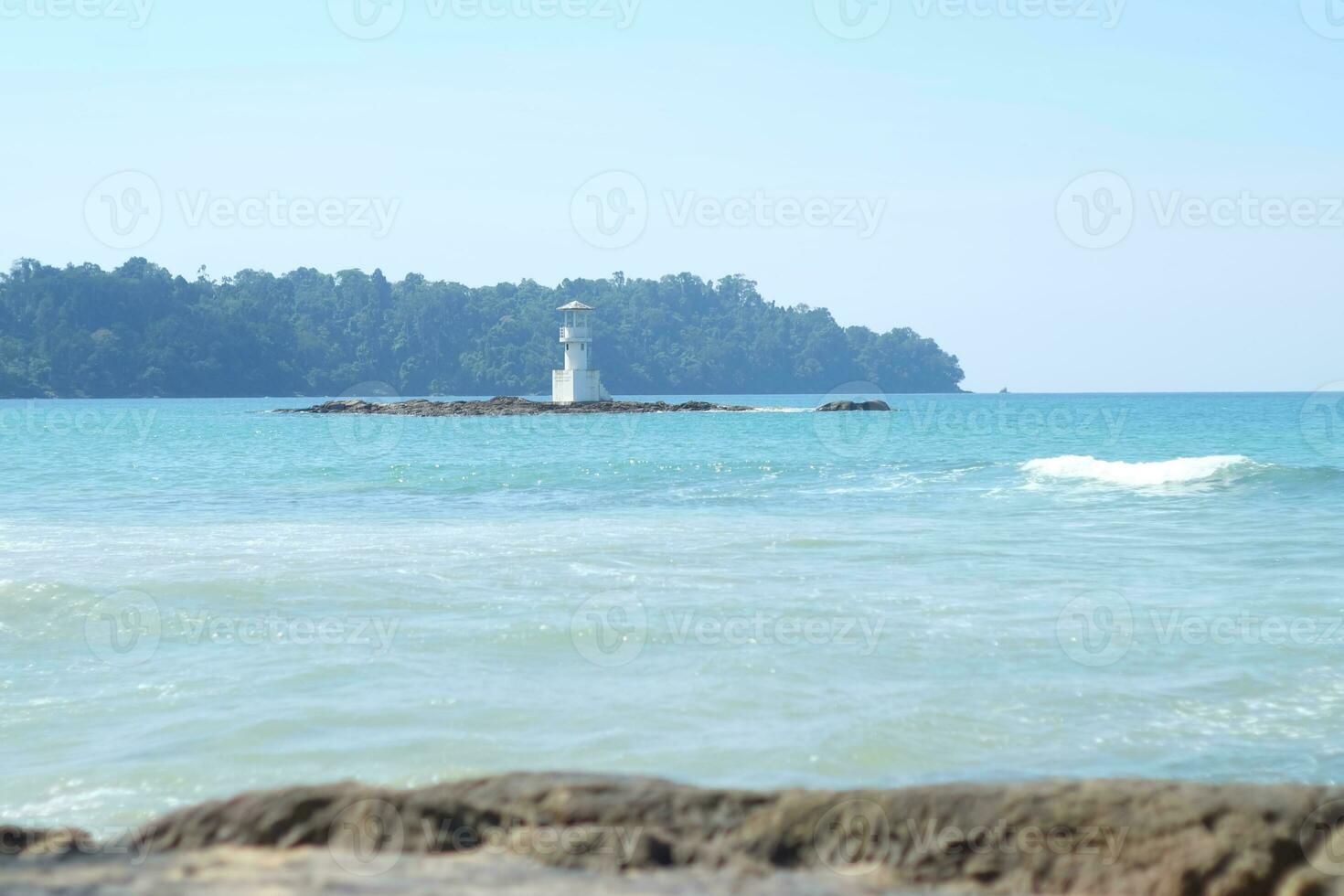 a view of the sea and the beach lighthouse photo
