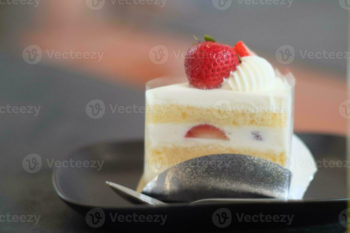 strawberry cake with whipped cream and strawberry topping photo