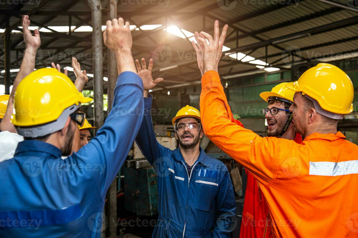 Group of Engineer Worker Team Cheerful Happy Greeting Celebrating Jobs Success Finished Hand Rising Together in Factory. photo