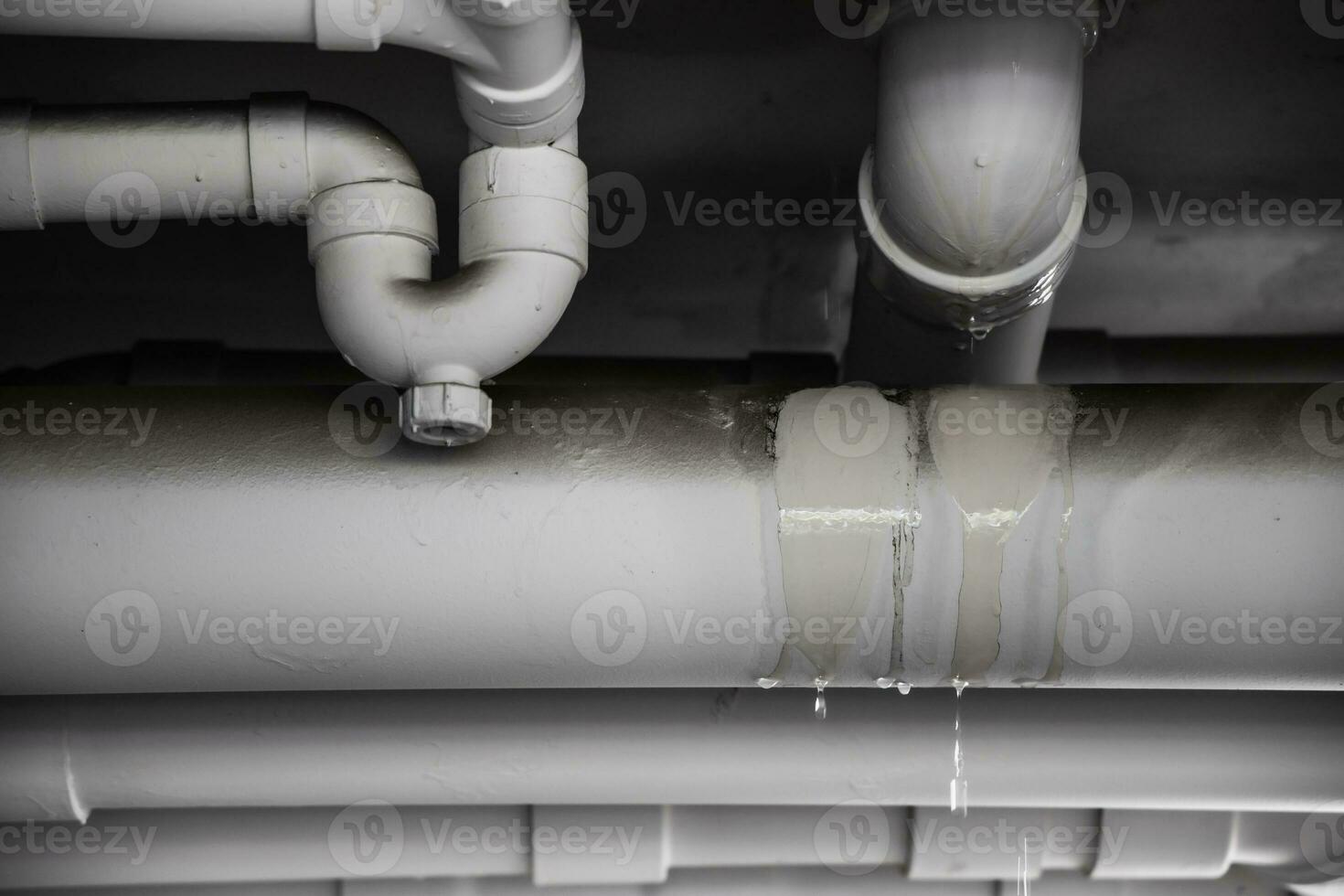PVC Water leak pipe, Building Drainage pipes crack seep problem need to fix photo